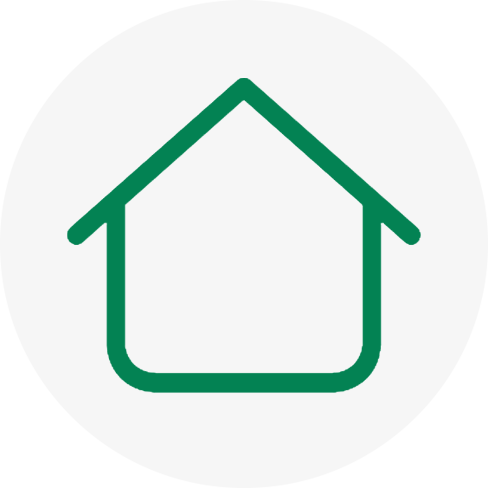 A green and white icon of a house.